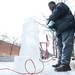 Van Calhoun makes a snowman out of ice using a chainsaw during Saline's Winterfest Saturday Jan. 26th.
Courtney Sacco I AnnArbor.com 